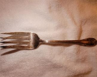 Plated Silver flatware 8 pieces plus serving utensils.