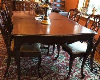Antique dining room table, table pads, 2 captains chairs, 4 side chairs and 3 leaves. Table measures 65" with (3) 12" leaves - $500    Table and chairs located in Berwyn.   Call or text Joanne at 708-890-4890 to schedule your appointment to view and purchase now!