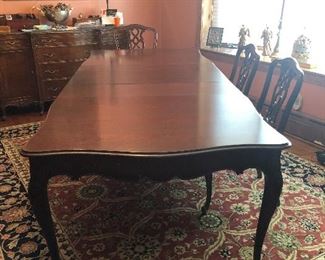 Antique dining room table, table pads, 2 captains chairs, 4 side chairs and 3 leaves. Table measures 65" with (3) 12" leaves - $500    Table and chairs located in Berwyn.   Call or text Joanne at 708-890-4890 to schedule your appointment to view and purchase now!