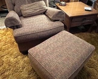 Upholstered Walter E. Smithe armchair and matching ottoman