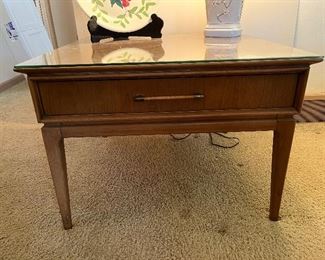 matching side table also has a glass top