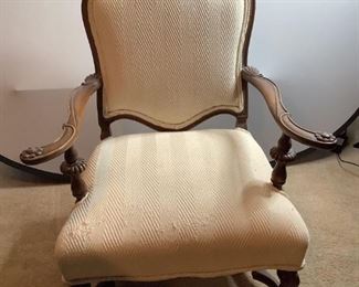 One carved dark wood with ivory textured fabric chair in Louis XV style, age unknown, appears to have been reupholstered in the past, has minor scratches, nicks in wood, seat has frayed areas on the fabric and soiling, H 38"x W 31"x D 29".