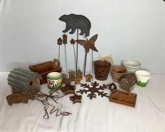 Includes six (6) metal lawn decor sticks ranging from H 22"x W 12" and H 14"x W 2", (5) plant pots ranging from H 6"x W 6" to H 4"x W 5", (6) small metal birdhouses H 3"x W 3", (3) wooden birdhouses, H 7"x W 7"and H 5"x W 4", and more! All in used condition.