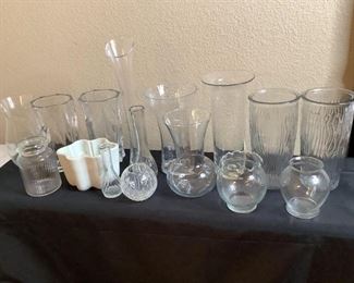 Approximately (15) vases, all but one are clear. All are different sizes, shapes, some have patterned glass and (1) is white ceramic, talles is H 15.5"x W 3" and the smallest is H 3.5"x W 4". All are used.