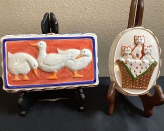 Two (2) ceramic jello molds: Rectangular ducks by The Haldon Group, H 2.5" x W 10" x D 6" and oval cats by Takahashi, H 2.5" x W 5" x D 7.5", small chip on rim of cat mold (see photo).