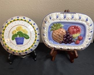 Two (2) ceramic jello molds by The Haldon Group: 9" Round yellow flower in blue pot and rectangular fruit, H 2.5" x W 11" x D 9", no visible damage.