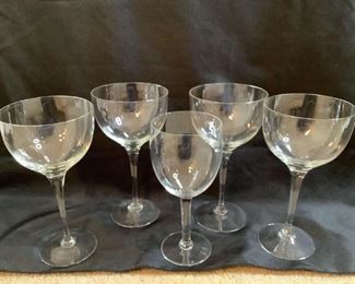 Includes (5) glasses, (4) are matching, H 9"x W 4.5" and (1) smaller glass, H 8.5"x W 3.5", all are used condition and may have scratches.