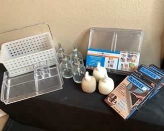 Includes (4) clear glass soap dispensers and (3) ceramic soap dispensers, (3) Ruggies, new in boxes, (2) cabinet shelves, new in factory wrap and (1) plastic bathroom caddy.