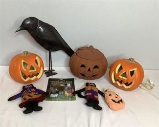 Includes (1) metal raven, H 18.5"x W 21", (2) plug-in Jack-O-Lanterns, H9"x W 9"x D 9", (1) powers on, (1) ceramic Jack-O-Lantern with lid, lid is chipped, H 10"x W 12", (1) crazy cat lady action figure in original package, (2) felt cats and (1) stuffed Jack-O-Lantern pillow. All are considered used.