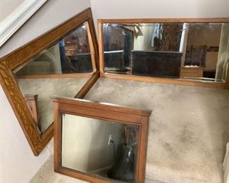 Includes (3) wood framed old fashioned rectangular shaped mirrors, (1) has black spots on mirror glass, H 19.5"x W 24.75", (1) has loose frame bottom right corner, H 20"x W 42" and (1) has streaks in mirror glass, H 23.5"x W 41.5". All have beveled mirror glass, scratches, scuffs and nicks in frames.