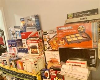 Large assortment of cooking items still in boxes
