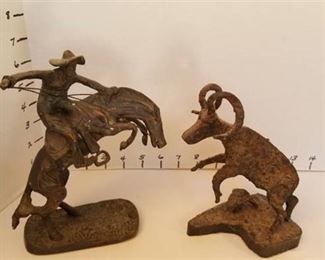Metal bronco buster statue and ram statue by RE Friedrich