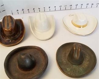2 Van Briggle cowboy hats, Hycroft 22k gold medicine hat and 2 metal hats