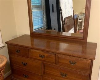 #11	Davis Cabinet Co. Dresser w/Mirror - 7 drawer - 55x20x30  Mirror - 43x33	 $275.00 			
