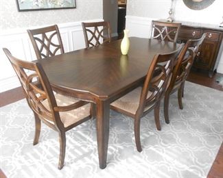 Elegant Dining Table and Pottery Barn Rug Chairshttps://www.potterybarn.com/products/scroll-tile-custom-rug-marine/?group=1&sku=3150237&pkey=call-rugs