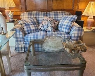 Plaid cloth love seat
Glass & metal coffee table