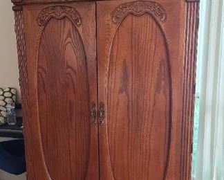 Armoire with inner mirrored doors