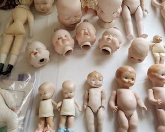 Three-faced doll heads, dolls and miscellaneous doll parts