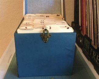 Box of 45 Vinyls and 4 record insert adapters