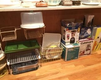 Misc Storage Shelves, Lazy Susans, KitchenAid Drain Basket, Small Appliances in boxes (Oster Blender, Rival Crockpot, Cuisinart Food Processor and more).