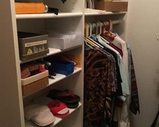 Misc Items on shelves: Hats, Umbrellas, Cedar Closet Hangers, Shoe Stretcher, Slippers.  Blouses (hanging)