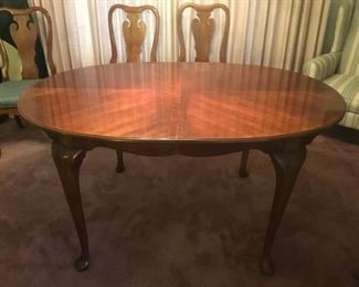 Dining Table wiht leaf removed measures 60in L x 42in W x 29.5in H
