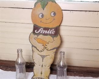 SMILE soda tin advertisement sign and 2 vintage bottles