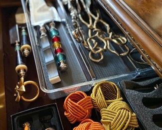 Select formal and artistic serving utensils. French knot napkin holders 