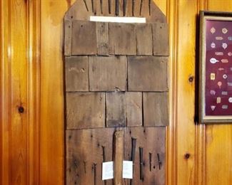 Wall display of hand-cut nails from late 19th century homestead...