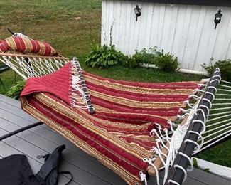 New hammock frame, one person white macramé hammock, two person reversible red/ red striped hammock. All carrying cases and hammock clips in case you want to hang between trees .
