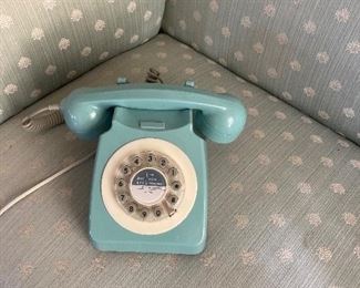 Two landline phones. Here’s a good close-up of the upholstery on the  living room set