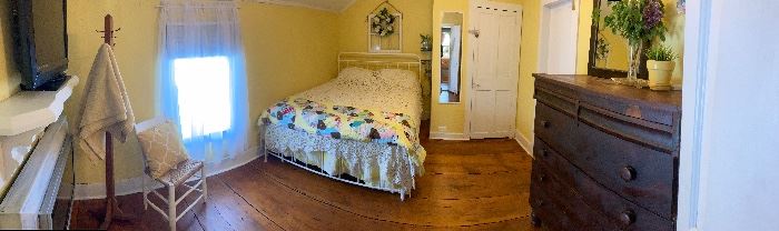 See Vizio TV and broomstick coverlet and yellow quilt 