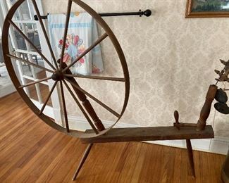 Antique spinning wheel. With all parts makes it a real find say dealers.
