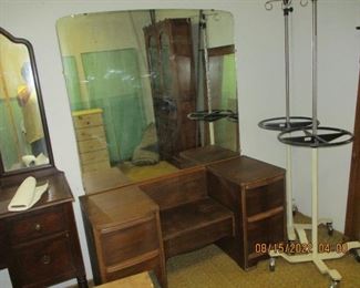 Old dresser with attached large mirror