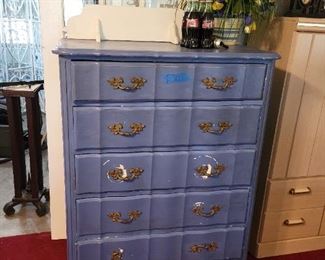 Blue dresser. Nascar coke bottles from 94 on top.