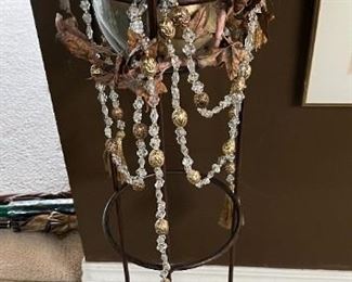 Wrought iron stand with glass insert + decorative balls