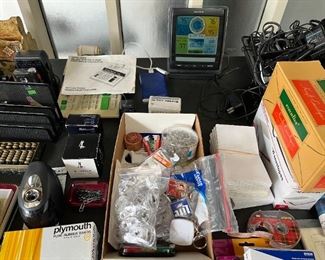 Lots of envelopes, legal pads, cards, ink, weather station, office items