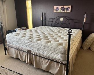 King size bed; mattress is clean and in good shape.  Bedframe is wrought iron and needs to be tightened up
