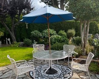 Patio set includes all you see: table, umbrella stand 4 chairs & rug