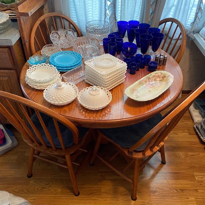 Dining table with additional leaf and four chairs — made in U.S.A.