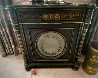 Black side table with gold trim and marble top