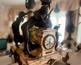 Samuel Marti Figural clock with two matching garnitures