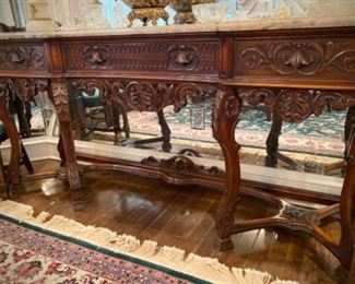Carved marble-topped buffet with three drawers