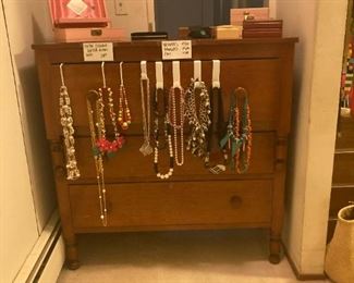 Necklaces, antique dresser, jewelry boxes