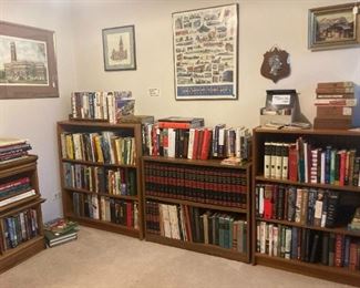 Books and bookcases and art and cigar boxes