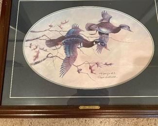 Numbered print framed under glass