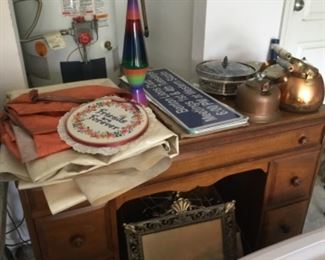 Nice desk, vintage lava lamp, brass tea kettles, frames & etc in Garage