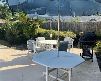 PVC patio furniture.  2 tables, 2 umbrellas, 6 chairs, 2 ottomans, 2 loungers 