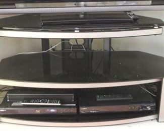 599 - Glass T.V. Stand - Stand only not contents 12"x21"x11"