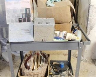 953 - Metal Cart with Assorted Contents 31" x 22" x 32" Please note that items stored in basement may be moldy